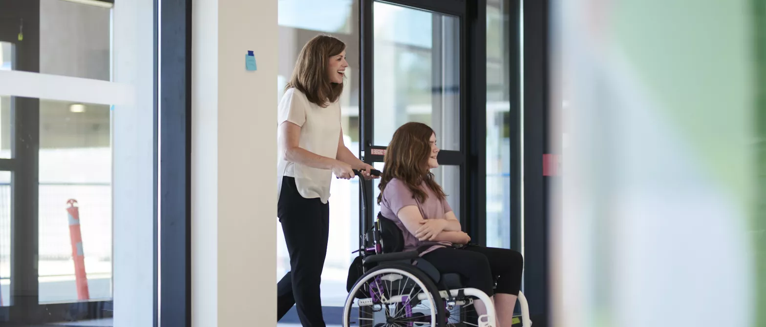 A parent and child entering BC Children's Hospital