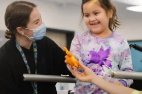 A physiotherapist working with a young patient